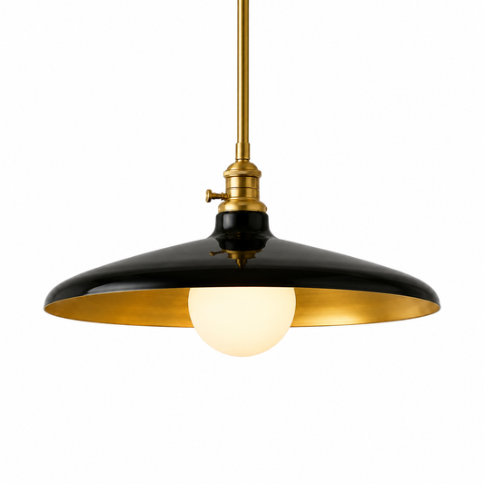 A modern pendant light fixture with a glossy black metal shade featuring a polished gold interior, suspended by a brass-toned rod with a glowing white globe bulb.