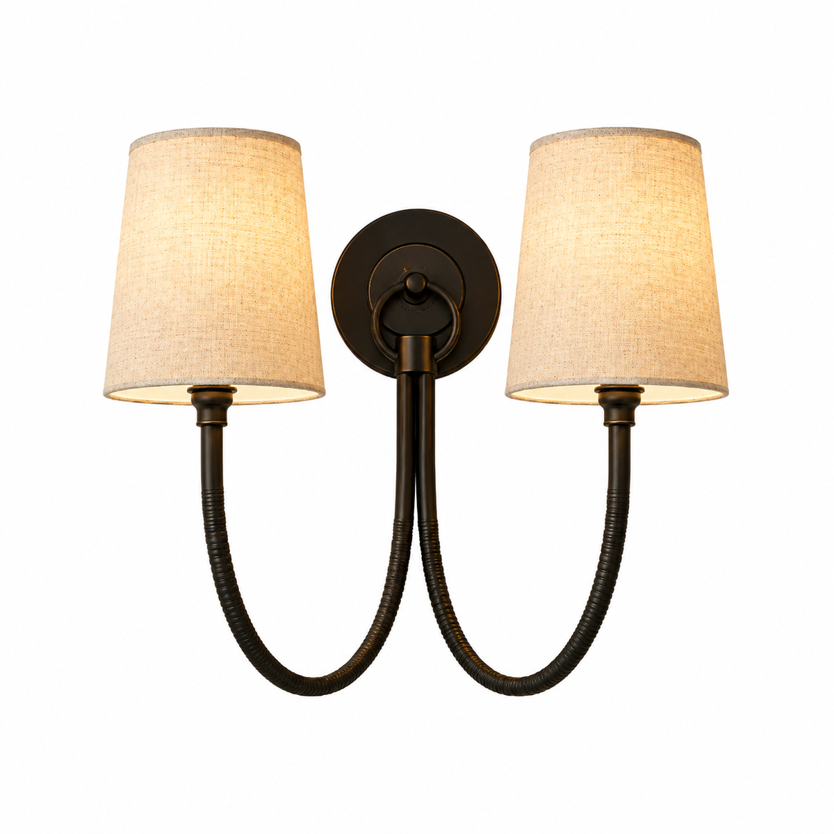 A two-light wall sconce with a dark bronze-finished metal frame, featuring two curved gooseneck-style arms and tapered beige linen drum shades, shown against a plain white background.