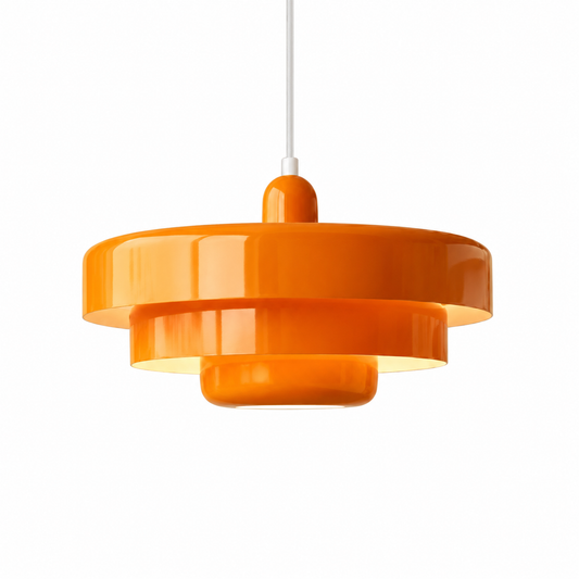 An orange glossy multi-tiered pendant light hanging from a white cord against a plain white background.