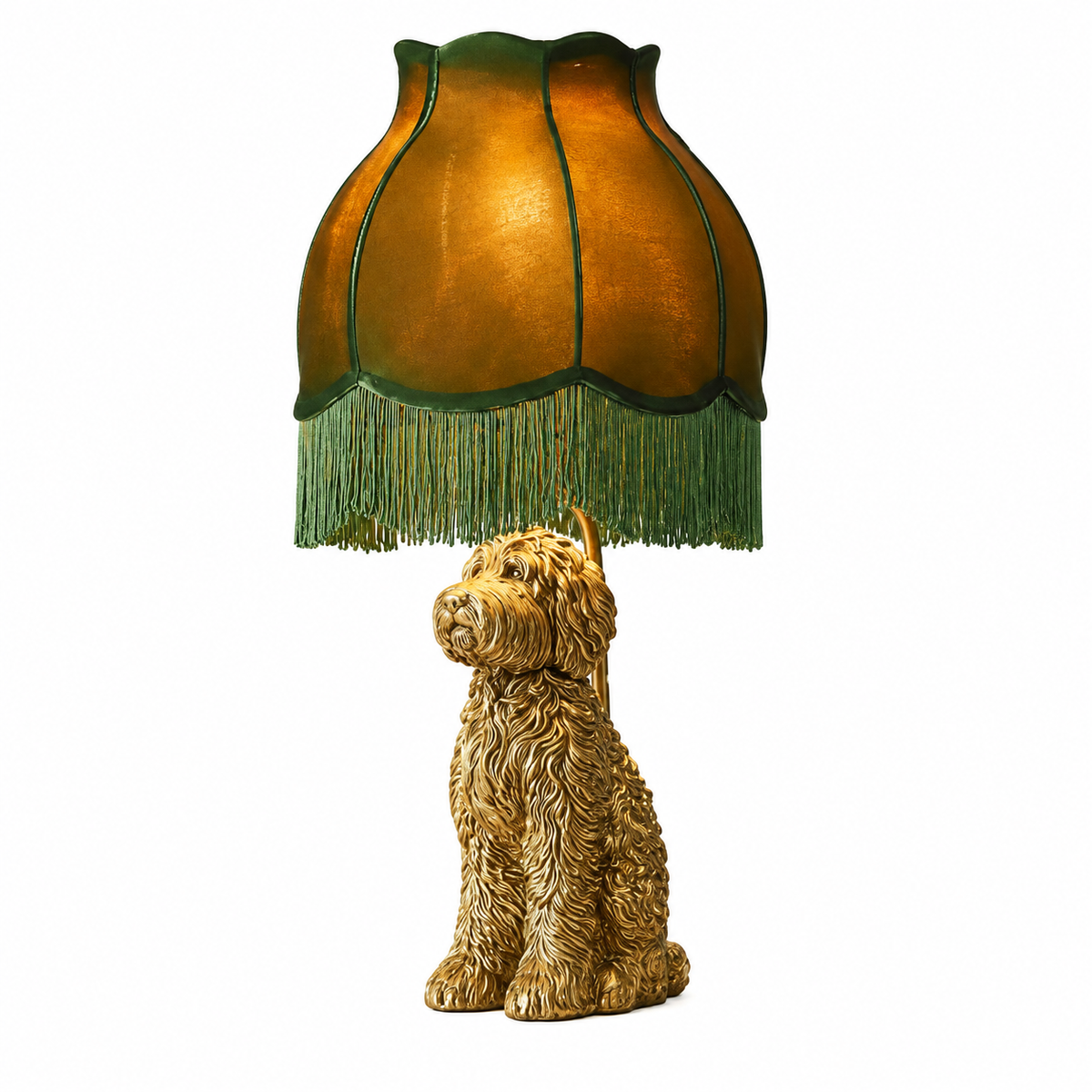 A decorative table lamp featuring a sculpted golden-brown dog base and a matching fringed shade in warm amber and green tones, shown on a plain white background.