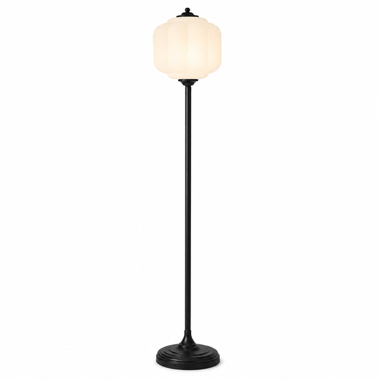 A modern floor lamp with a black metal stand and a ribbed, bell-shaped white glass shade that glows with warm light, set against a plain white background.